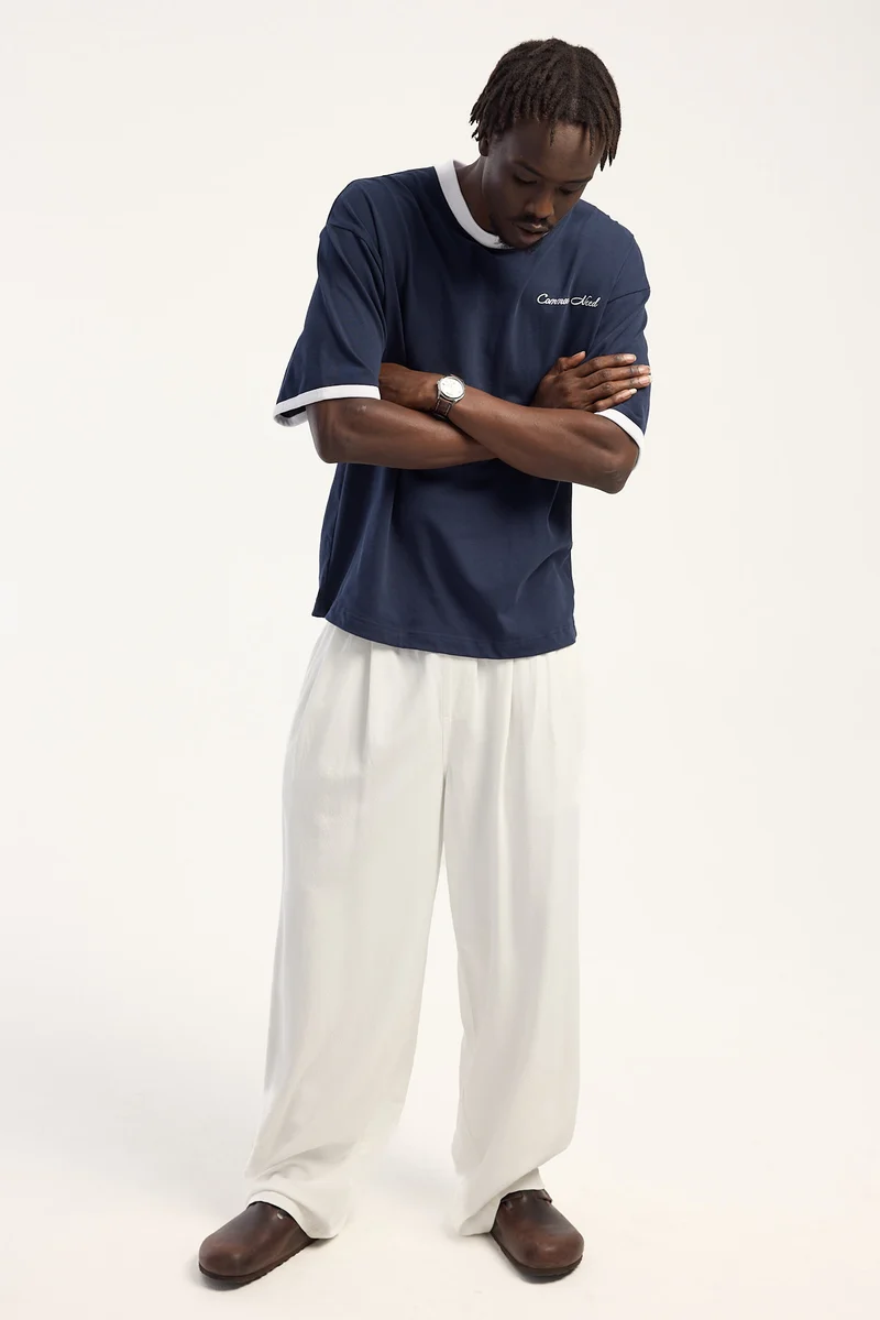 Common Need Benedict Baggy Pleated Pant Off White